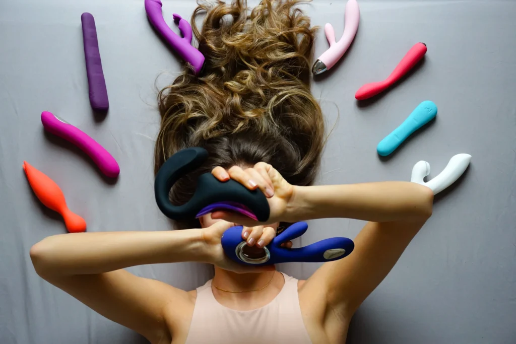 Assorted sex toys displayed on a bright background