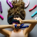 Assorted sex toys displayed on a bright background