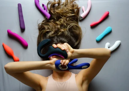 Assorted sex toys displayed on a bright background