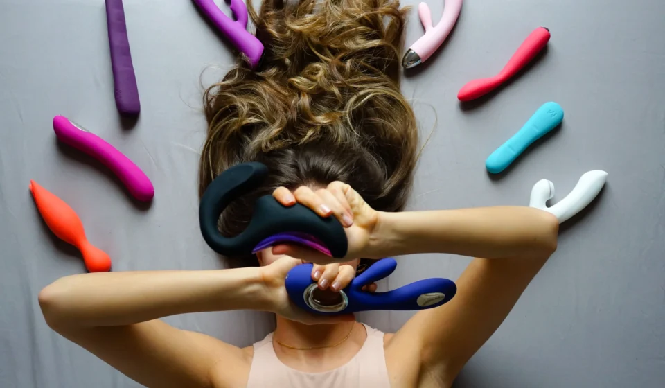 Assorted sex toys displayed on a bright background