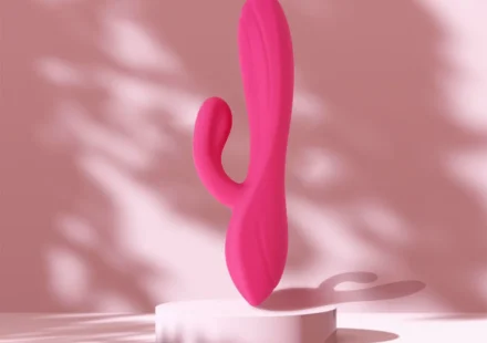 Pink rabbit vibrator displayed against a soft pink background