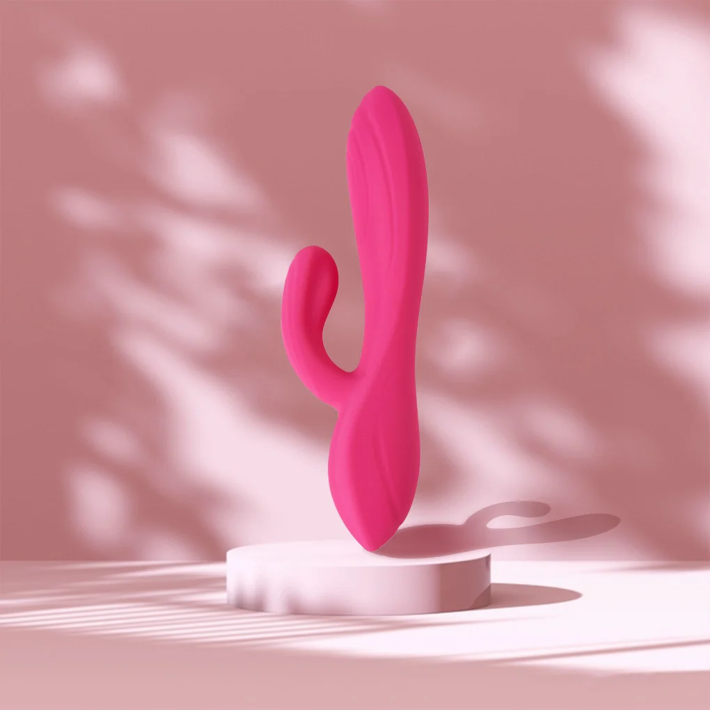 Pink rabbit vibrator displayed against a soft pink background
